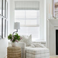 Oversized plaid chair on beige and pale blue rug