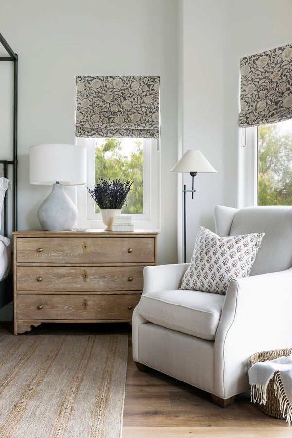Solid oak storage chest with limewash finish in primary bedroom.