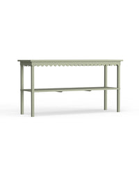 A rectangular green console table with a scalloped edge design and metal legs.