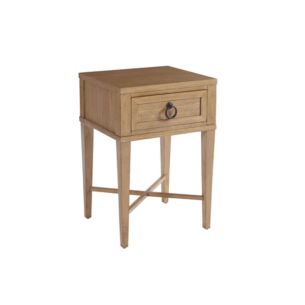 Light brown wood nightstand with one drawer featuring a circular drawer pull