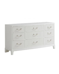 A white triple dresser with nine drawers, polished nickel hardware, and bracket feet.