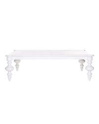 A white rectangular coffee table with delicate, scroll-like legs and no visible storage compartments.