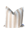 Striped pillow with beige and white pattern on a white background