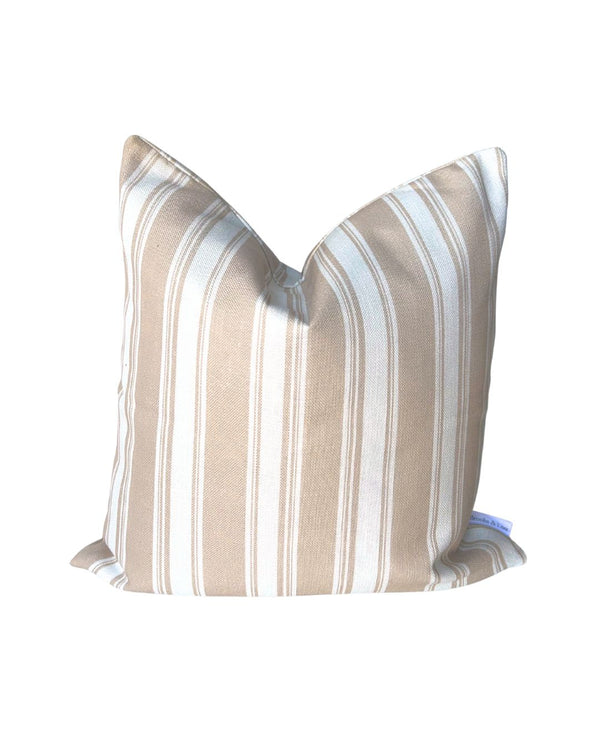 Striped pillow with beige and white pattern on a white background