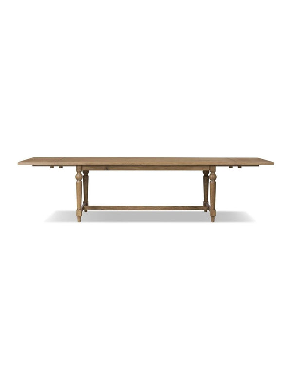 A rectangular dining table with a solid oak base and a warm oak veneer tabletop.