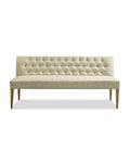 An upholstered bench with a tufted back, featuring a moss green fabric and a driftwood finish wood frame.