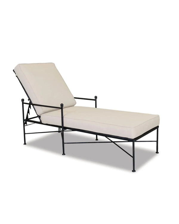 An Emmeline chaise with a beige cushion, featuring a wrought iron frame with a brushed Pewter antique finish.