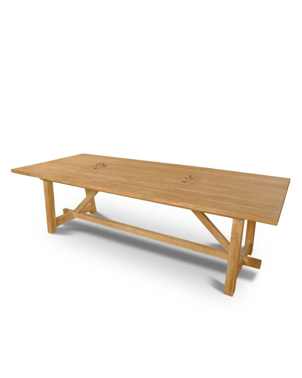 A rectangular rustic wooden dining table with angled legs and a removable tray.
