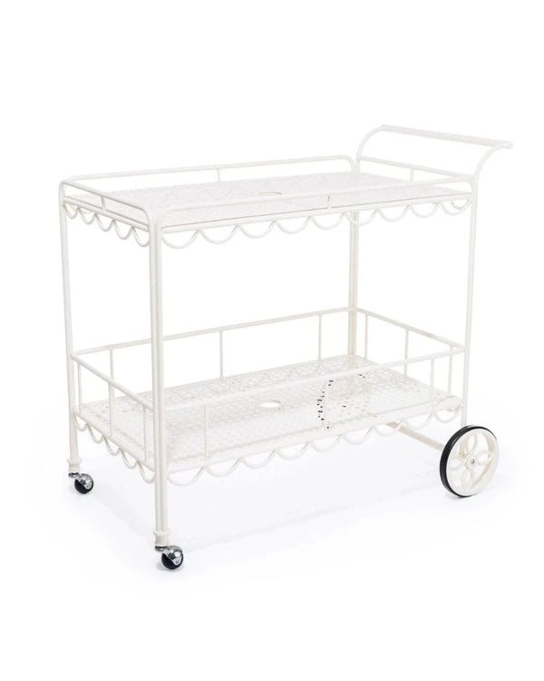 A vintage-inspired white bar cart with scalloped edges and a sleek, smooth surface, featuring metal construction and wheels for mobility.