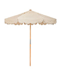 A beige and white striped patio umbrella with a scalloped edge and a wooden pole.