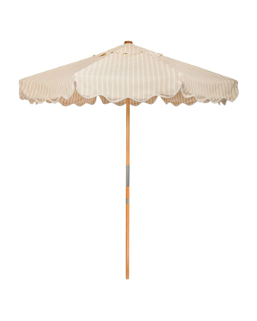 A beige and white striped patio umbrella with a scalloped edge and a wooden pole.