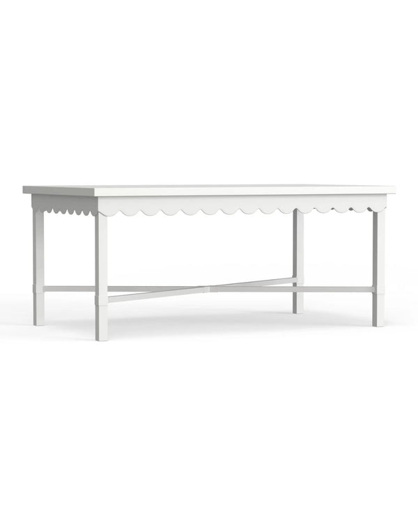 A white rectangular outdoor coffee table with scalloped edge details made of aluminum.
