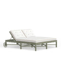 A Riviera Double Chaise Lounge with a scalloped back in Sage green with white cushions on a clear background.