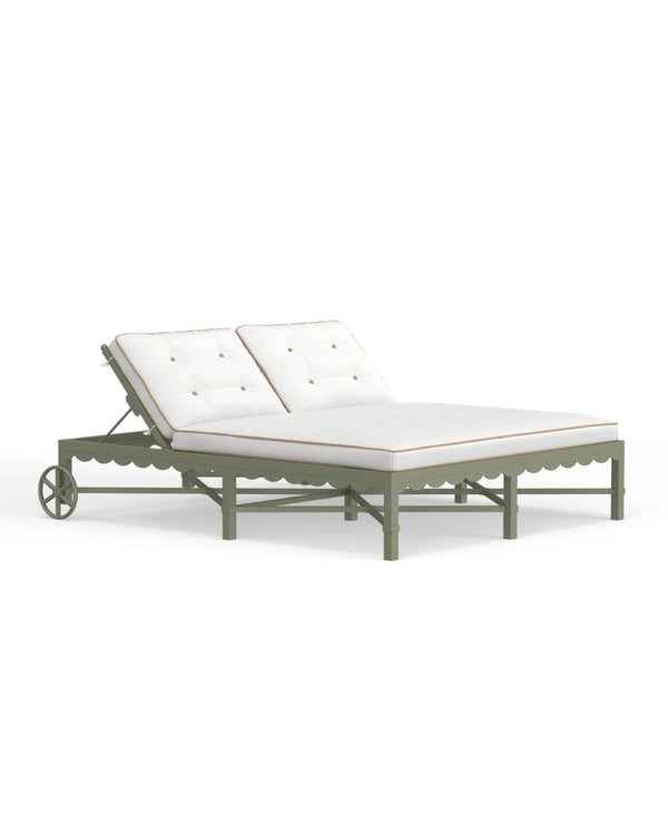 A Riviera Double Chaise Lounge with a scalloped back in Sage green with white cushions on a clear background.