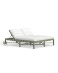 A Riviera Double Chaise Lounge with a scalloped back in Sage green with white cushions on a clear background.
