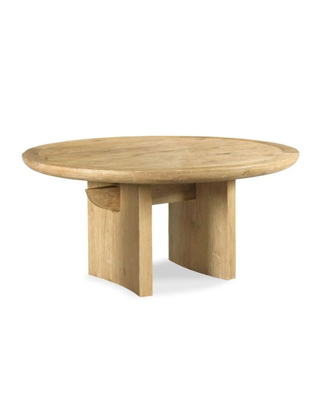 A rounded, oak wood dining table with a curved slab leg and a central beam, inspired by a Japanese Torii Gate.