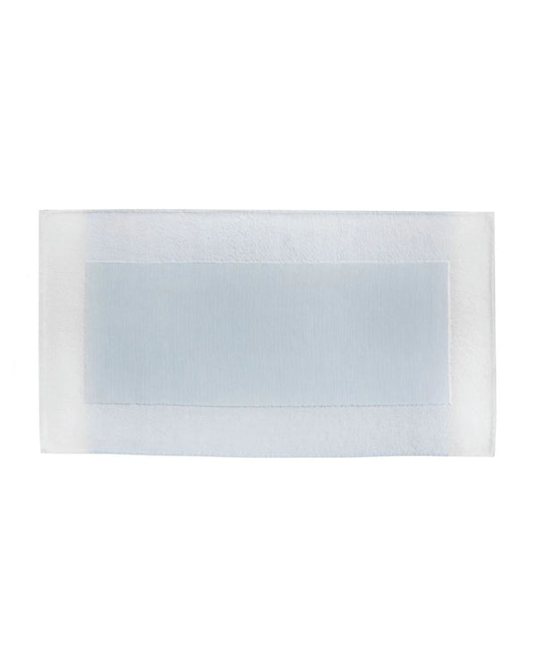 A blue and white colorblock border bath mat made of cotton, displayed on a plain background.