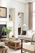 Rectangular coffee table with herringbone top sitting a natural toned living room