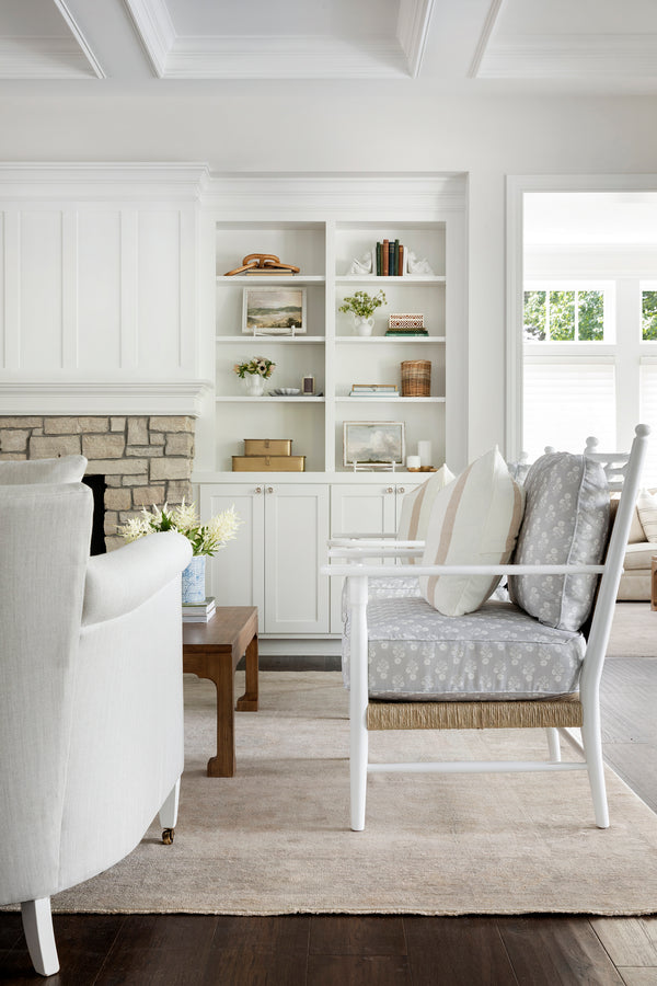 White sitting room with 100% wool rug with antiqued warm tones