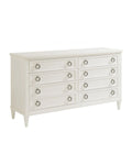 A white double dresser with eight drawers, featuring aged pewter hardware and tapered feet.