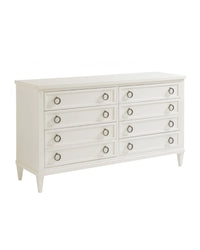 A white double dresser with eight drawers, featuring aged pewter hardware and tapered feet.