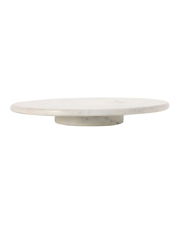 A white marble lazy Susan with a smooth surface and rounded shape, placed against a neutral background.