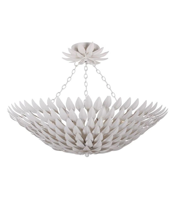 A white floral-inspired pendant light fixture with hand-painted leaves.