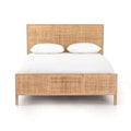 Bed frame designed with a natural mango frame and woven cane inset