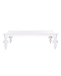 A white rectangular coffee table with delicate, scroll-like legs and no visible storage compartments.